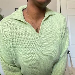 Knitted pastel green sweater